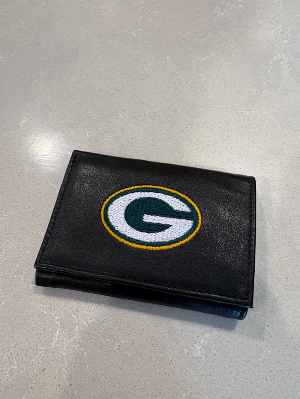 Black Bi-Fold Wallet with Green Bay Packers logo.